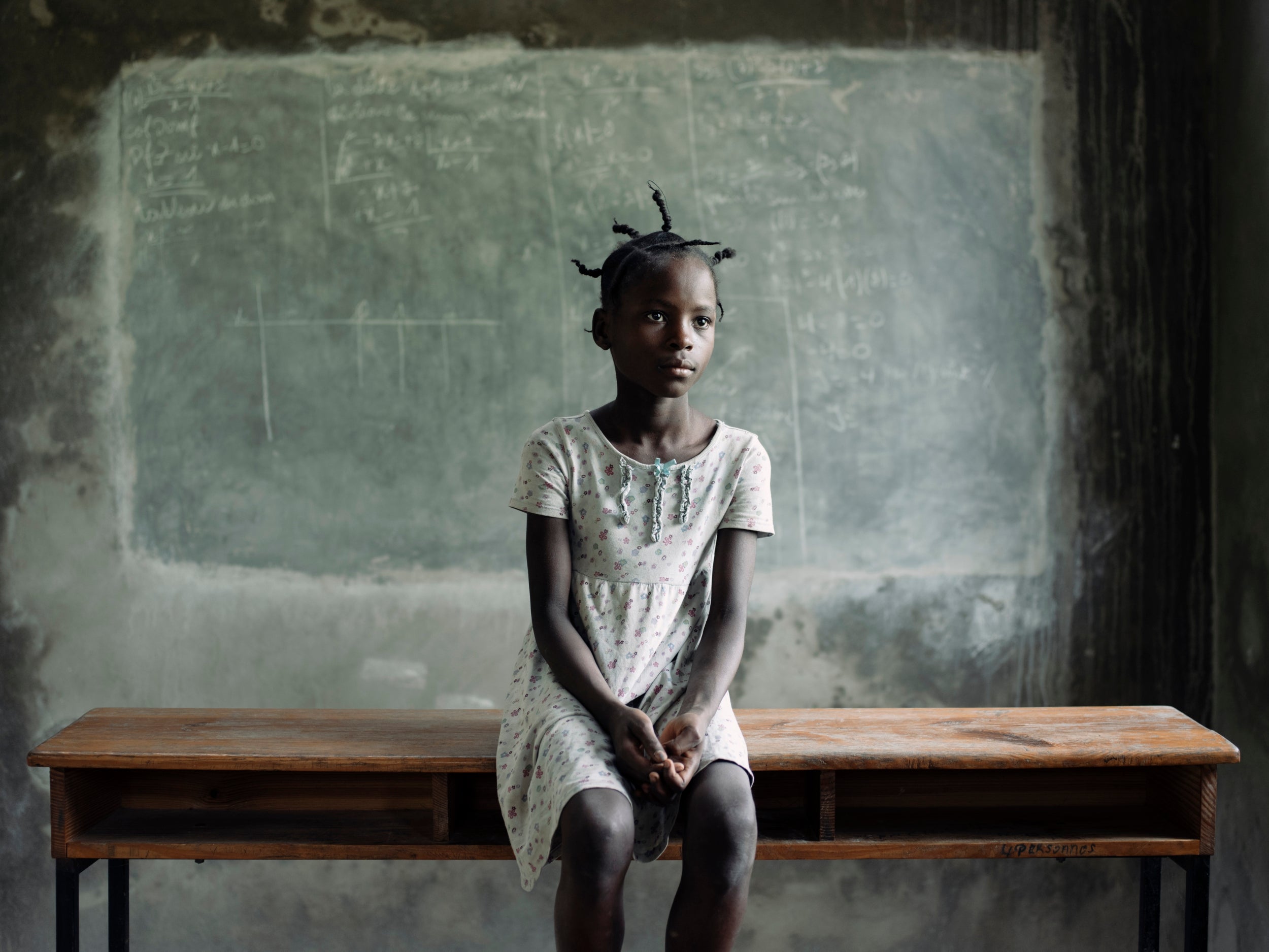 Jasme, 10, is enrolled at a buildOn school in Perigny. Her two brothers and three sisters all attend the same school. Unlike the reported 300,000 restavek children that live away from their biological parents, Jasme lives with her family.