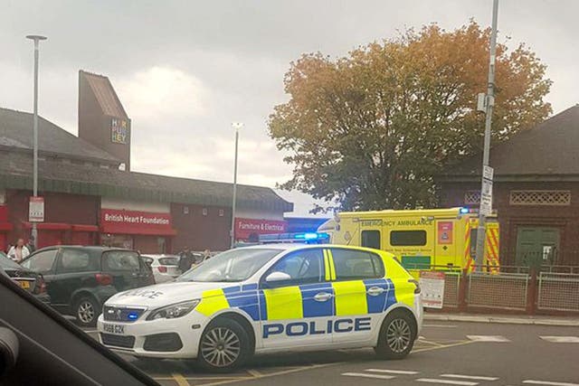 Police at the scene in Harpurhey, Manchester, after responding to reports of a stabbing at a McDonald's branch.