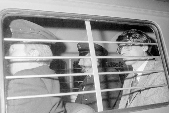 File photo dated 4 November 1983 of serial killer Dennis Nilsen (right) with a prison warden at his side after he was sentenced to a minimum of 25 years imprisonment after being convicted of six murders and two attempted murders at the Old Bailey.