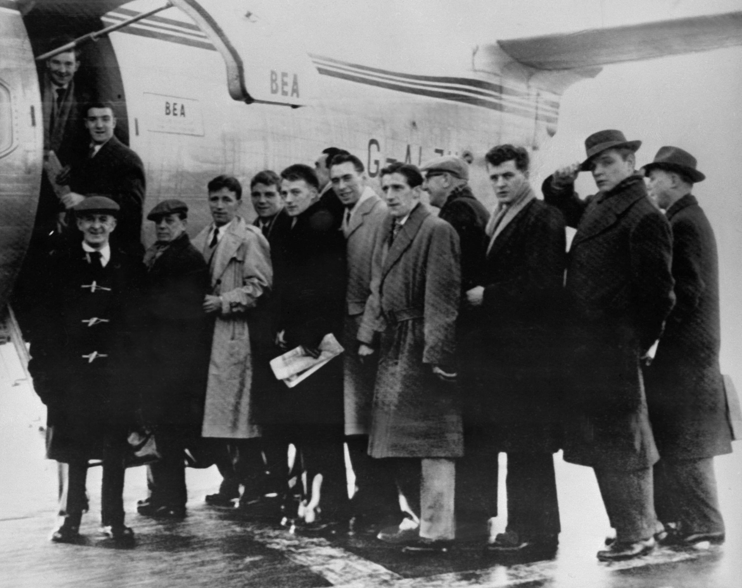 Manchester United players, staff and journalists prepare to board before the Munich air disaster