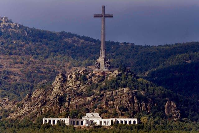 A general view of the Valle de los Caidos (Valley of the Fallen) mausoleum in San Lorenzo del Escorial during the exhumation of Spanish dictator Francisco Franco on October 24, 2019 JAVIER SORIANO / AFP