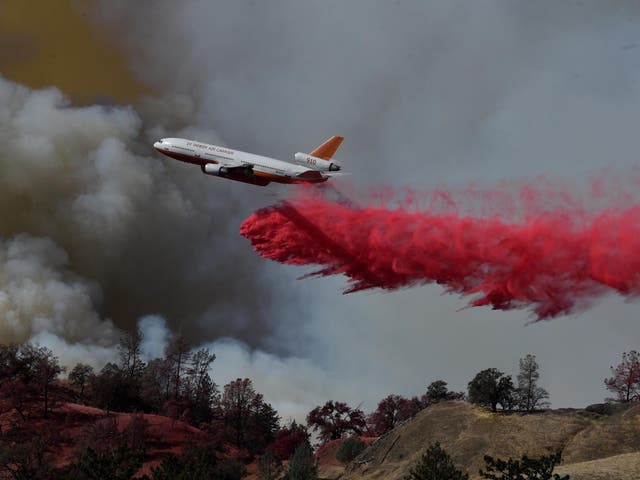 A fire fighting aircraft intervene in a fire broke out at Geyserville town in Sonoma County, California
