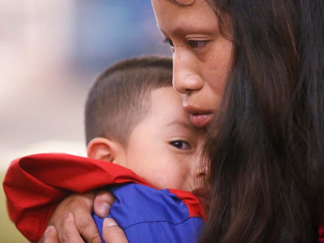 Mother, Maria, with her four-year-old son Franco after being separated for more than six weeks after entering the US