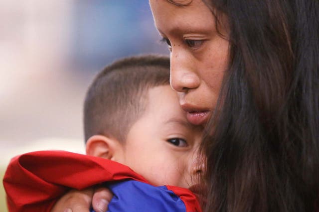 Mother, Maria, with her four-year-old son Franco after being separated for more than six weeks after entering the US