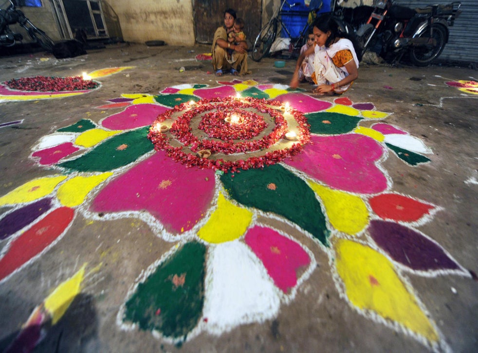 A Hindu girl in Pakistan decorates a rangoli for Diwali in October 2008