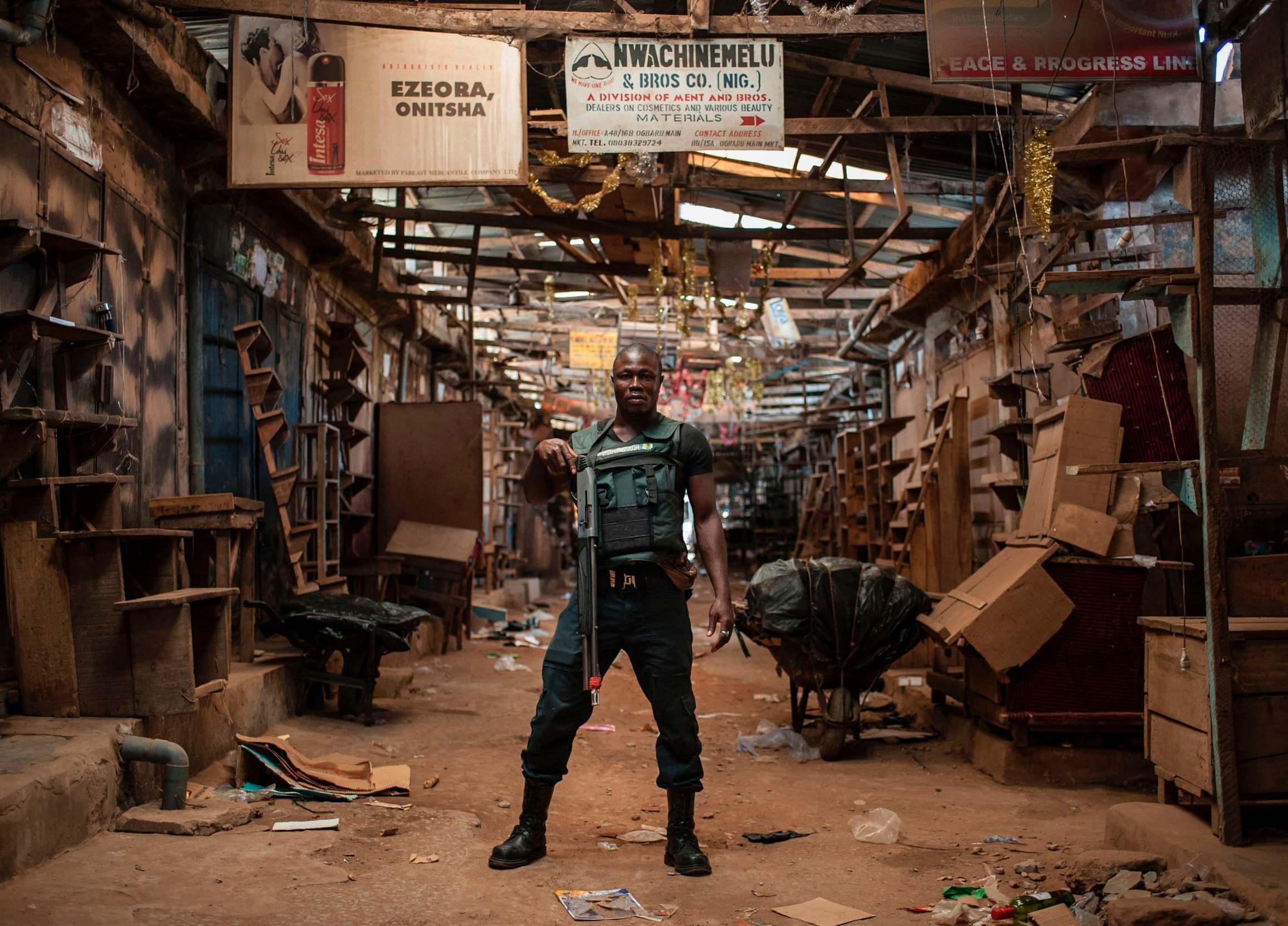 A security guard in the empty Ogbaru Market in 2017, closed to commemorate the 50th anniversary of the Nigerian Civil War