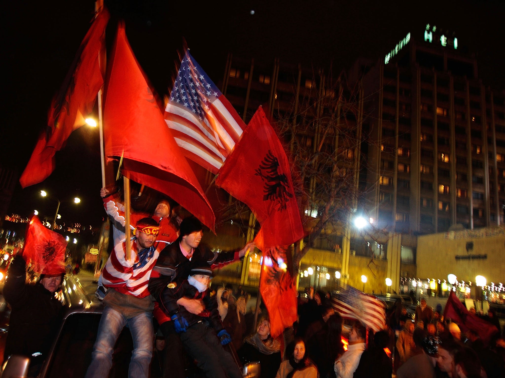 Albanian youths buzz with excitement in Pristina ahead of the formal announcement of Kosovo’s independence in 2008