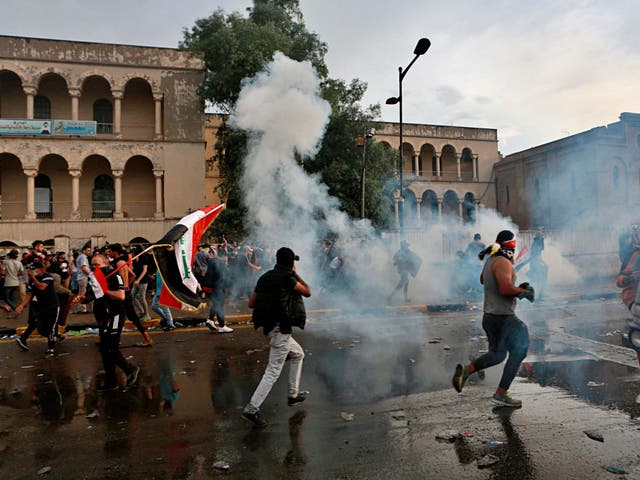 Security forces fire tear gas to disperse anti-government protesters in Baghdad