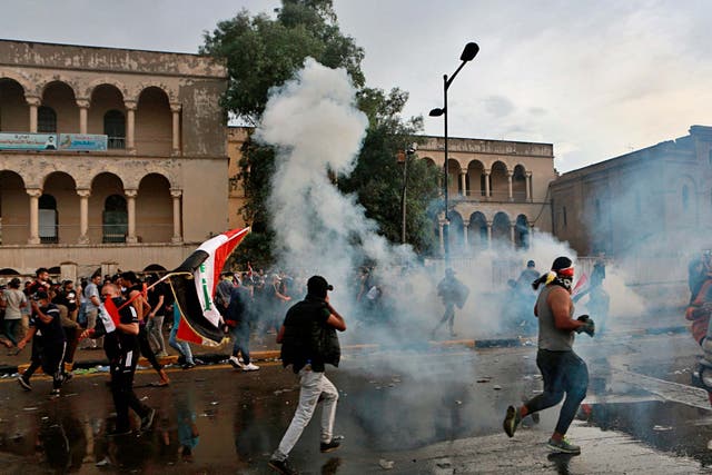 Security forces fire tear gas to disperse anti-government protesters in Baghdad