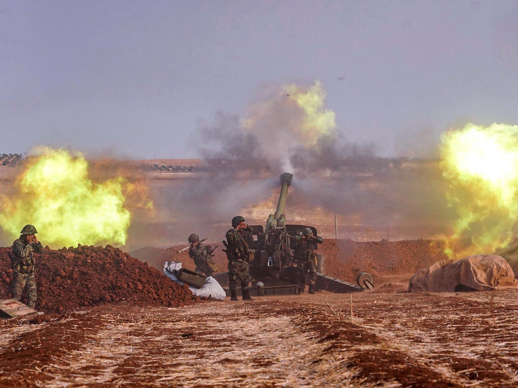 Syrian army artillery guns fire on the southern edges of the Idlib province this week