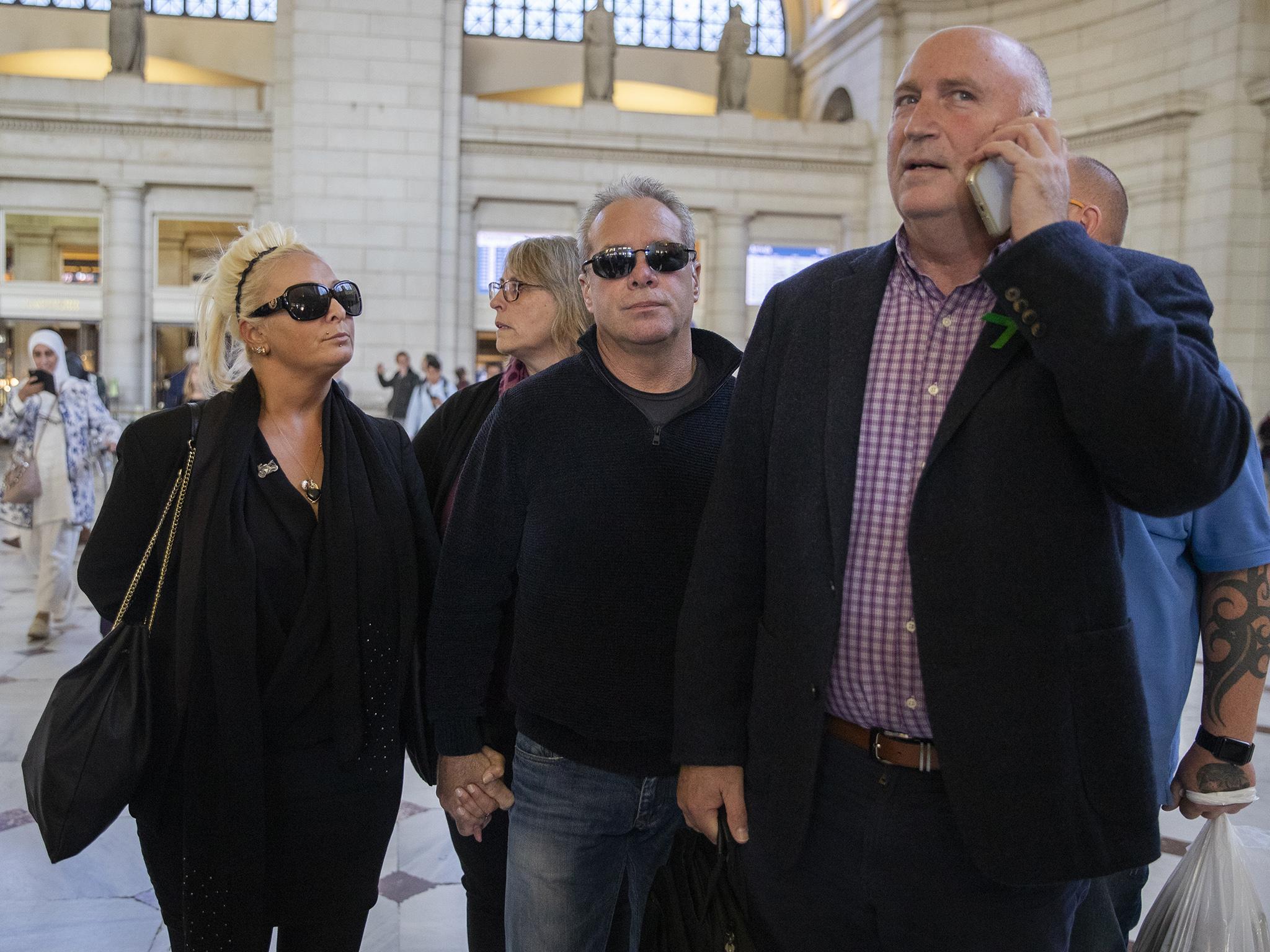 Harry's parents, Charlotte Charles and Tim Dunn, pictured with family spokesperson Radd Sieger