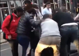 Members of the public can be seen tackling the third suspect to the ground, before bystanders start punching and kicking him
