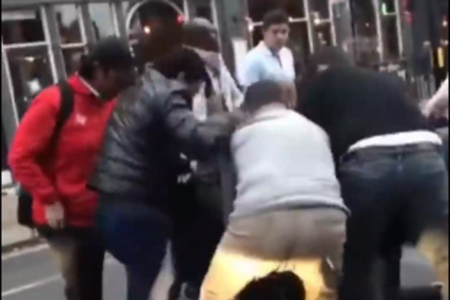 Members of the public can be seen tackling the third suspect to the ground, before bystanders start punching and kicking him