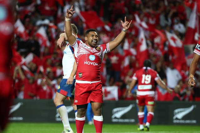 Siliva Havili of Tonga celebrates his side's victory over Great Britain