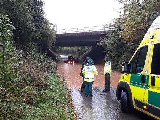 UK weather: Motorists rescued from flooded roads as heavy rain brings travel disruption