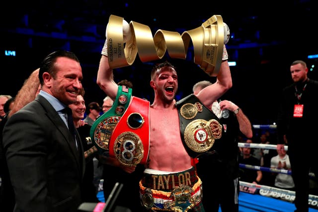Taylor celebrates unifying the light welterweight division and winning the WBSS 