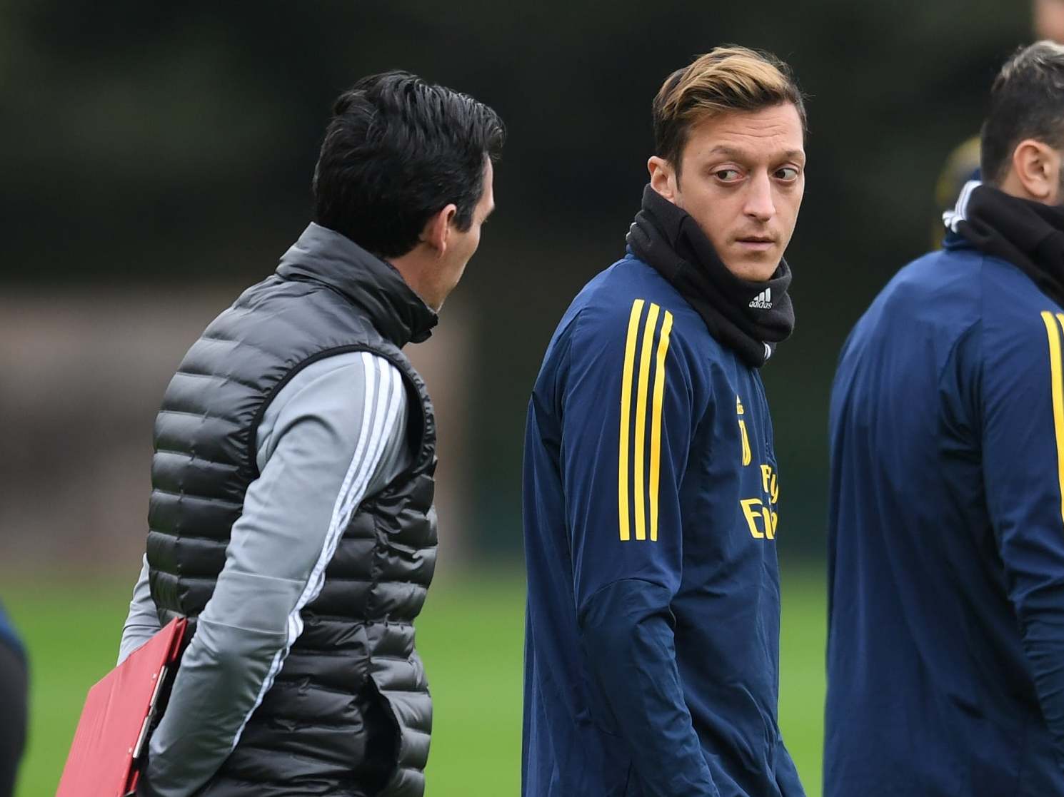 Mesut Ozil of Arsenal and Unai Emery