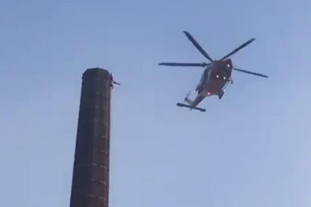 Still image from video footage of a man trapped at the top of the 290-ft Dixon's Chimney in Carlisle, 28 October, 2019.