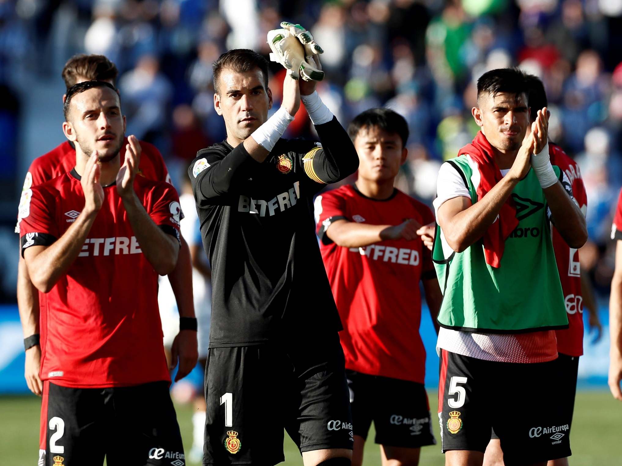 Mallorca's players applaud their fans after the game