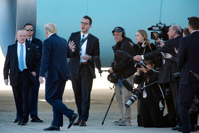 Donald Trump walks towards Air Force One at Andrews Air Force Base after speaking to reporters