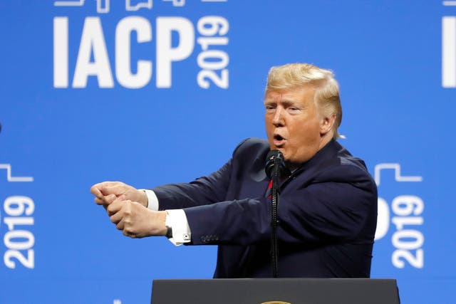 Donald Trump simulates a police officer shooting the Dayton, Ohio mass killer in front of a police conference in Chicago
