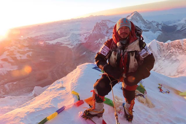 Photo taken on 22 May shows Nepali climber Nirmal 'Nims' Purja at the summit of Mount Everest