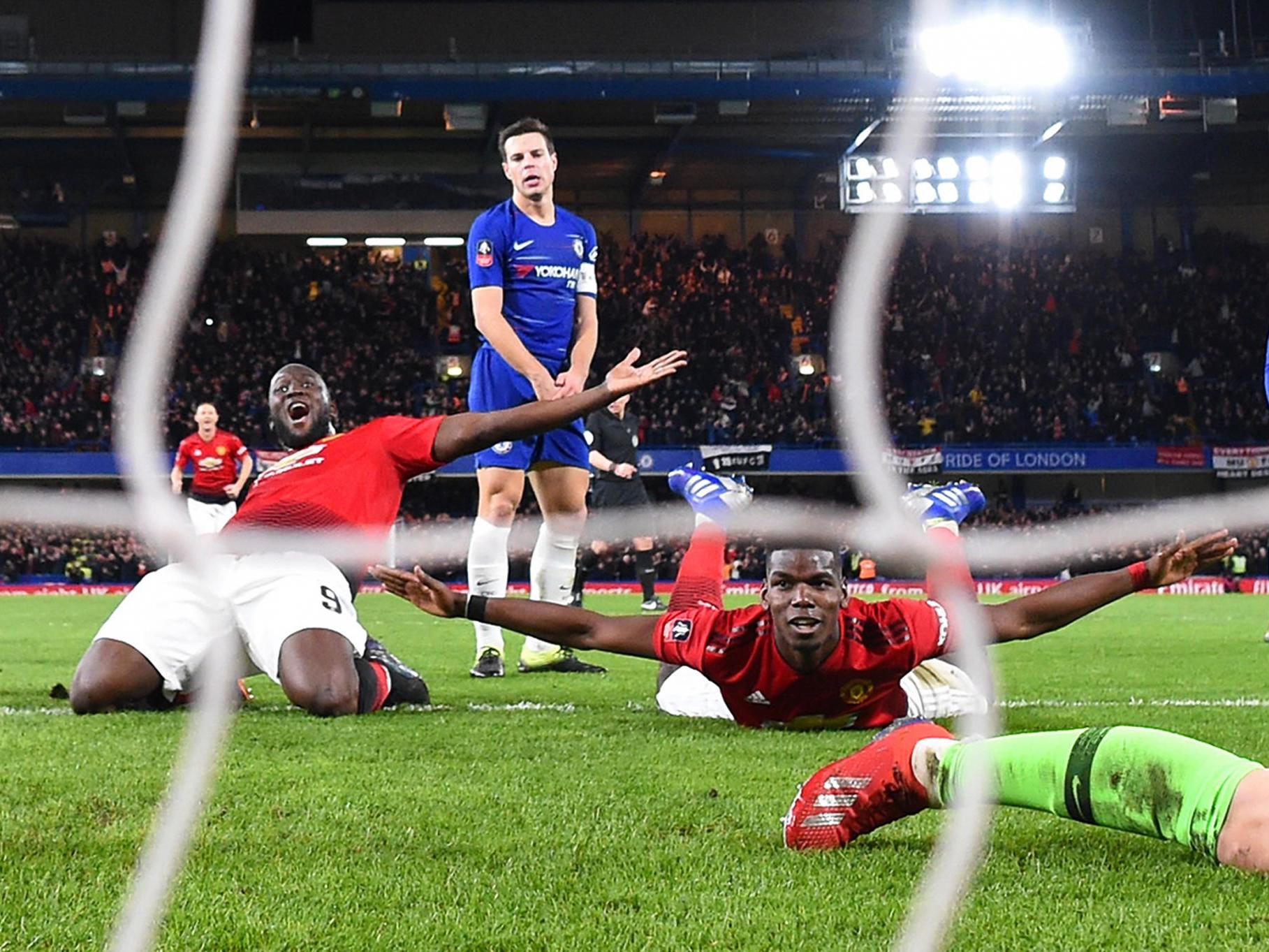 Paul Pogba of Manchester United celebrates with Romelu Lukaku