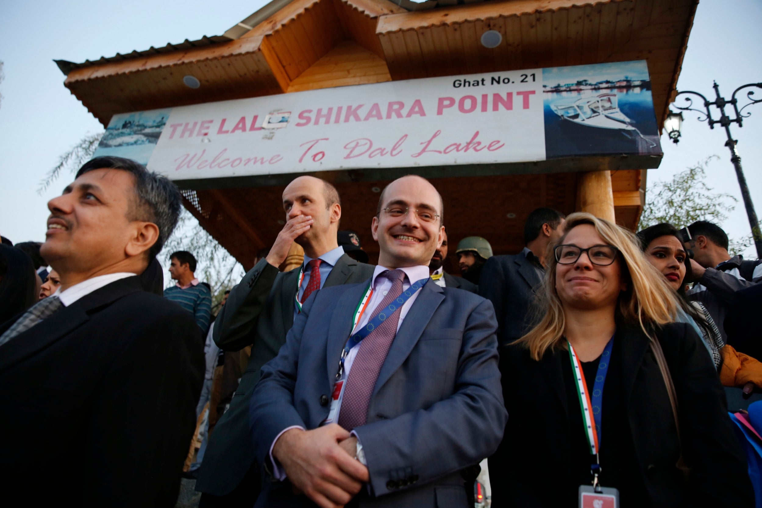 Members of the European delegation wait to enjoy a boat ride on Srinagar's Dal Lake