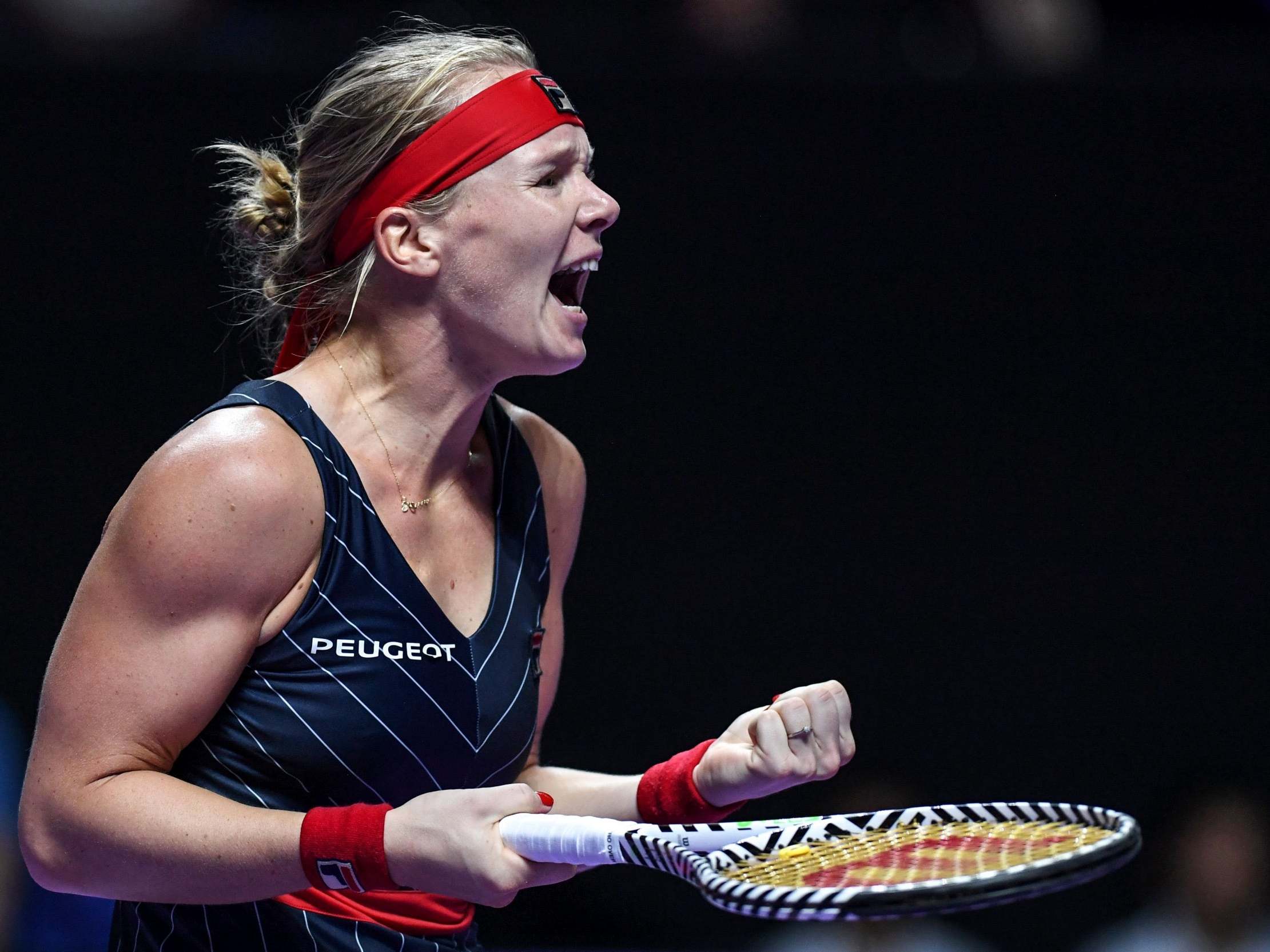 Kiki Bertens celebrates defeating Ashleigh Barty