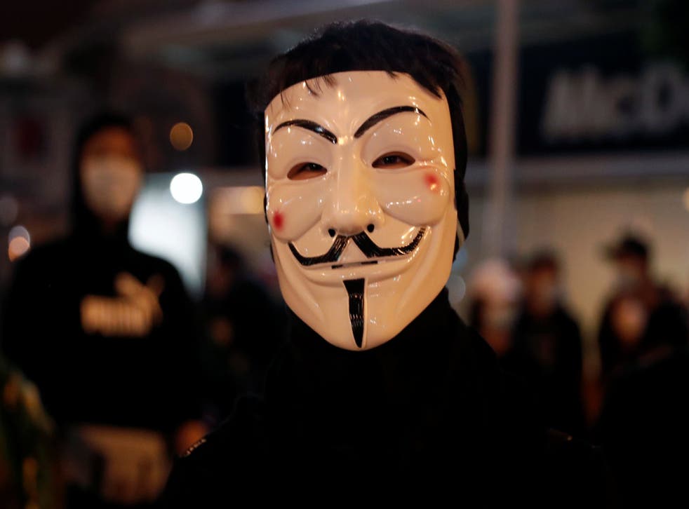 A protester wears a mask during an anti-government rally in Hong Kong on Wednesday