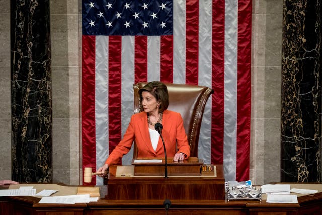 House Speaker Nancy Pelosi bangs the gavel after a vote to formalise the impeachment inquiry against Donald Trump