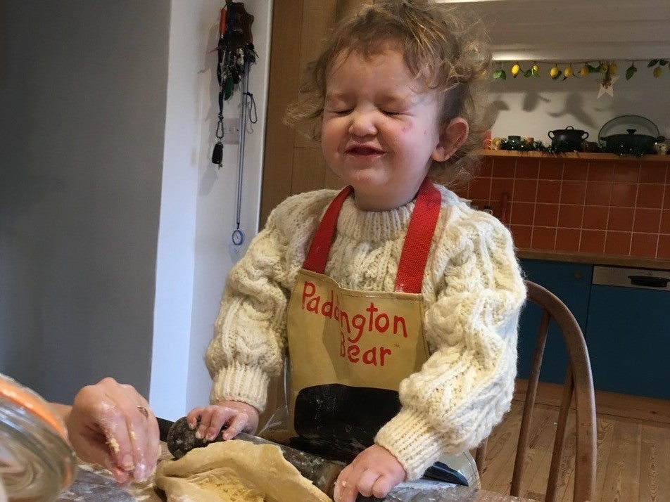 Three-year-old Lyra making gingerbread for Christmas