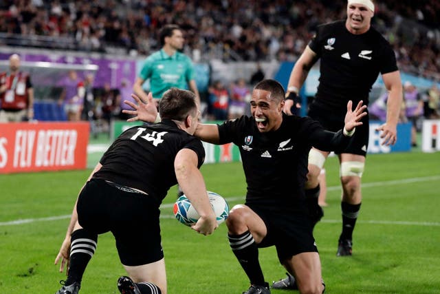 New Zealand's Ben Smith is congratulated by teammates