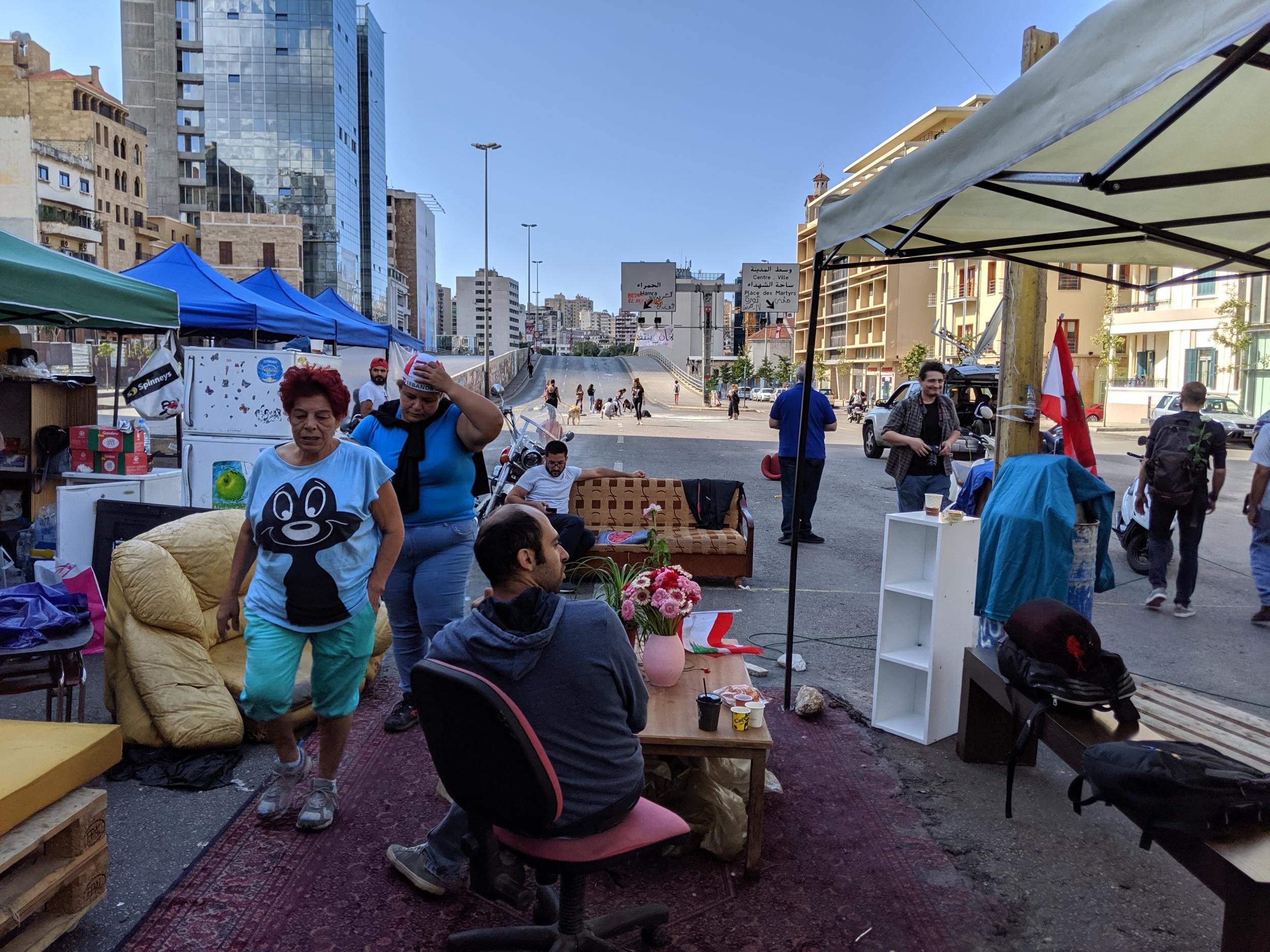 Protesters set up a living room on the main ring road in Beirut as part of a road block
