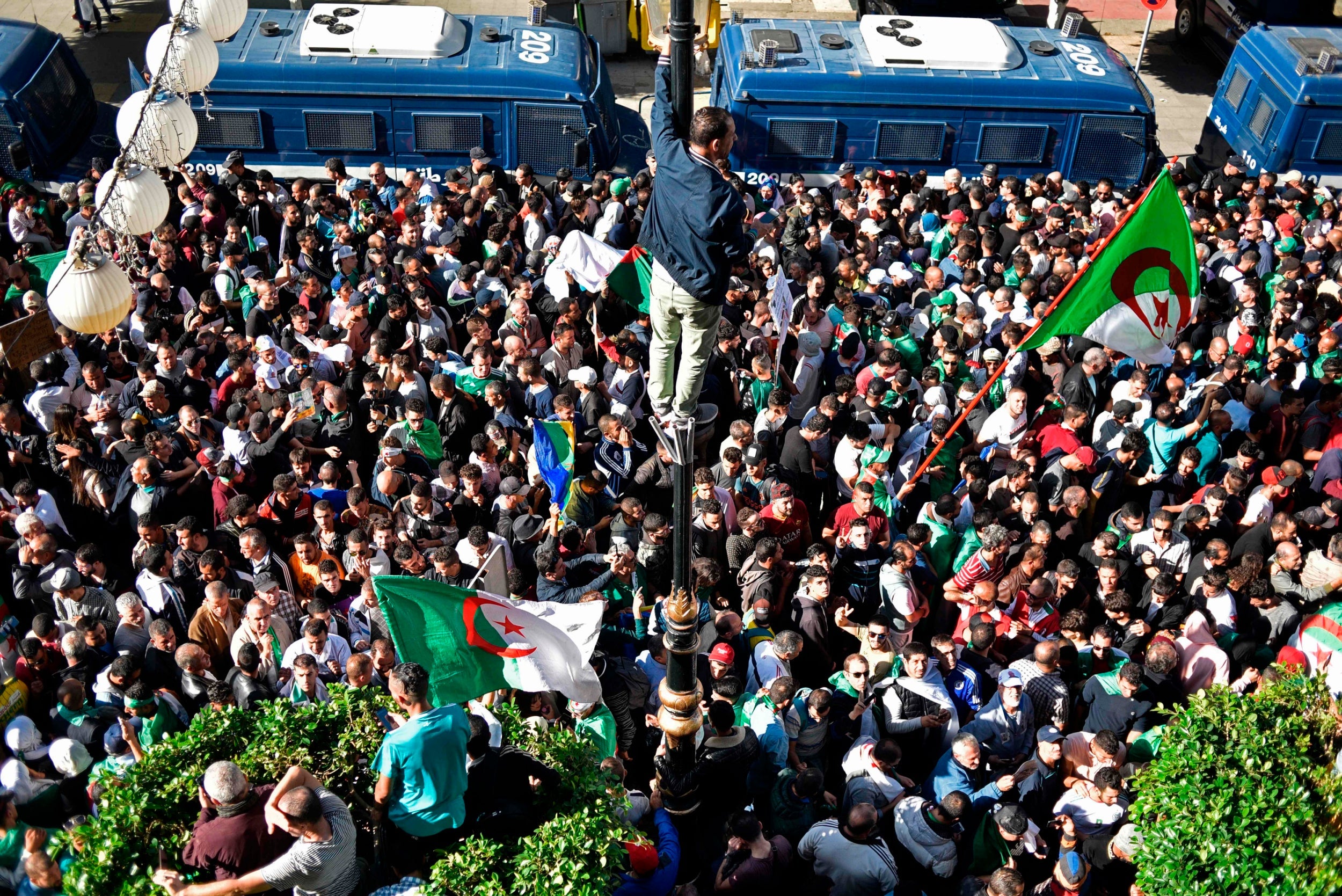 Algerians take part in an anti-government demonstration in the capital Algiers on November 1