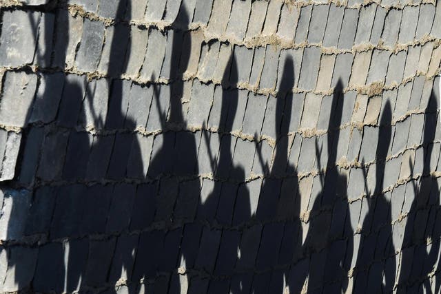The shadows of Russian servicemen are seen on pavestones at Red Square prior to the Victory Day military parade in Moscow in 2018
