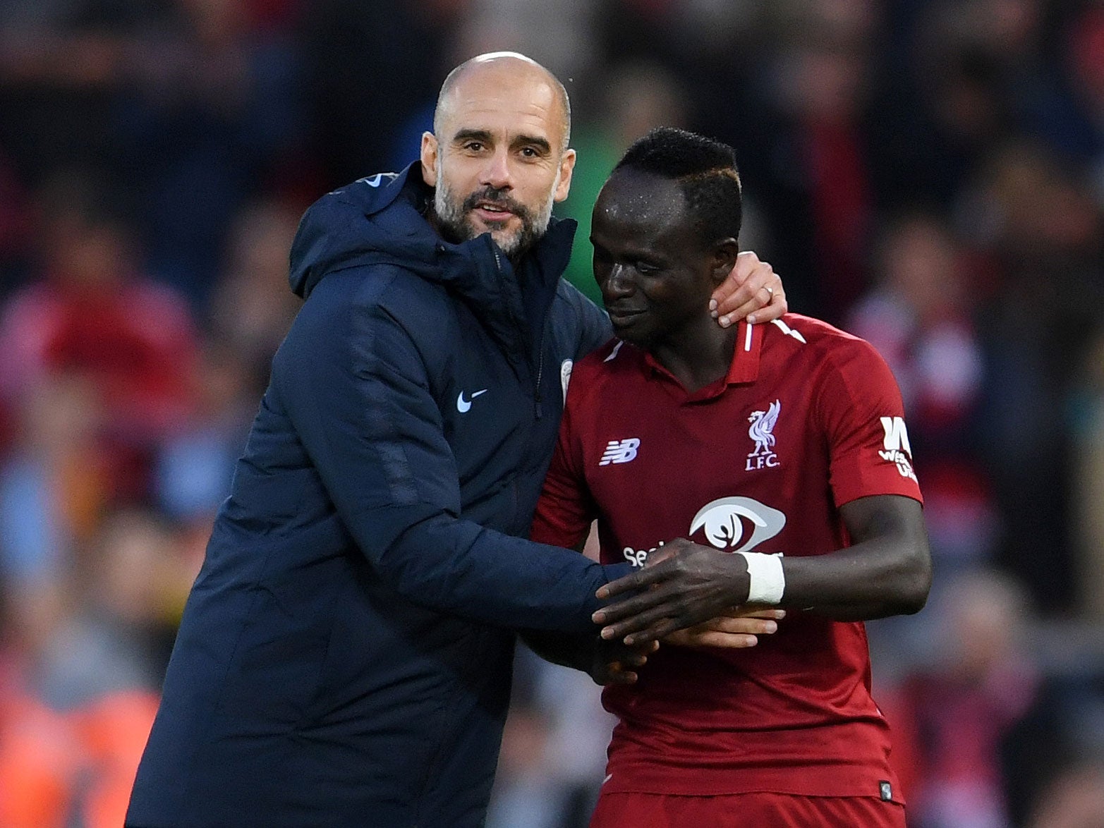 Manchester City manager Pep Guardiola and Liverpool's Sadio Mané