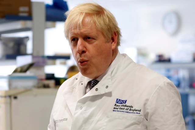 Boris Johnson speaks to staff at the East Midlands and East of England Genomic Laboratory.