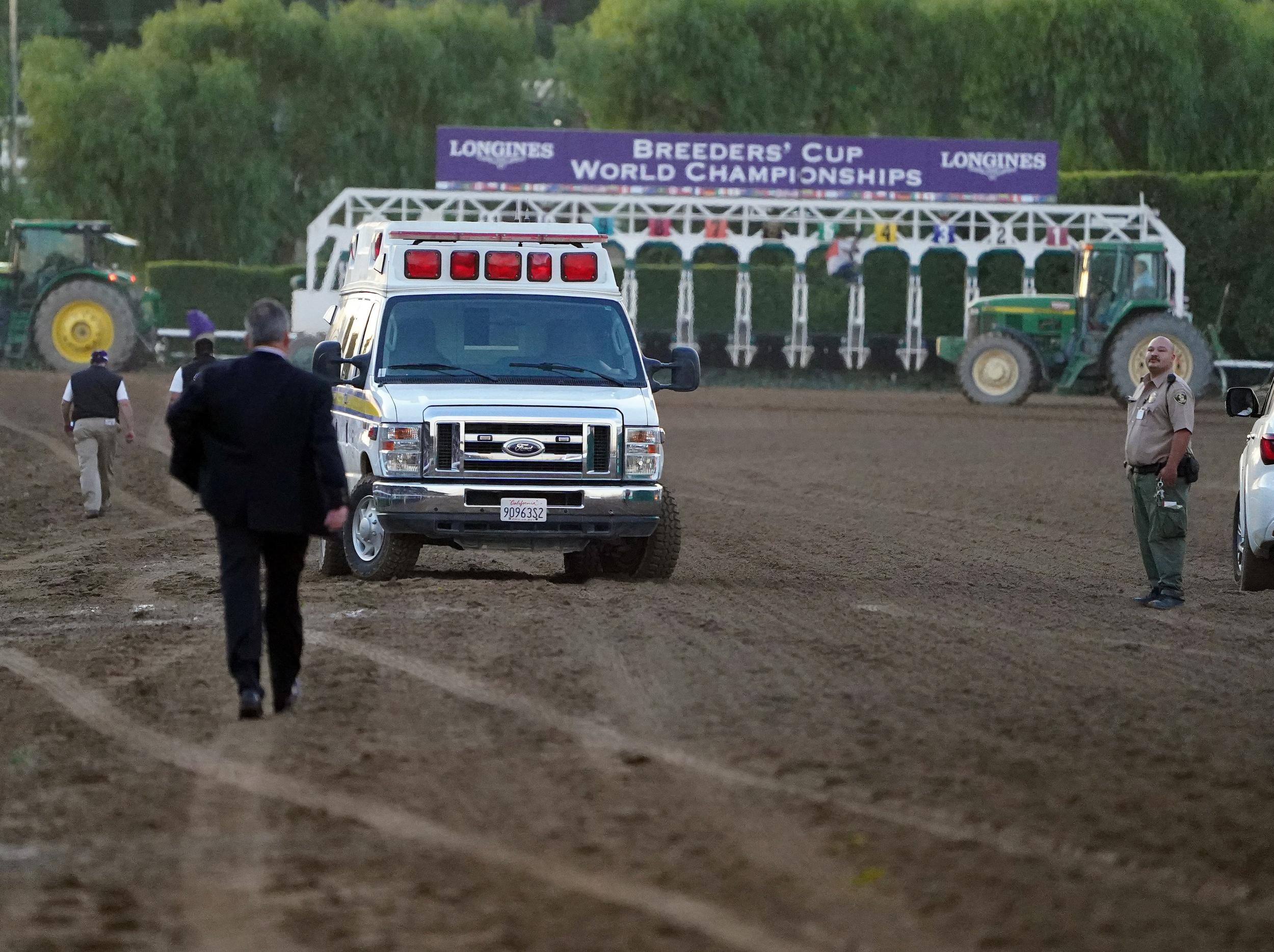 An ambulance drives onto the race track