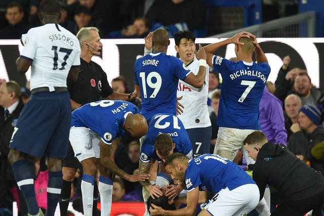 Cenk Tosun tried to comfort injured teammate Andre Gomes