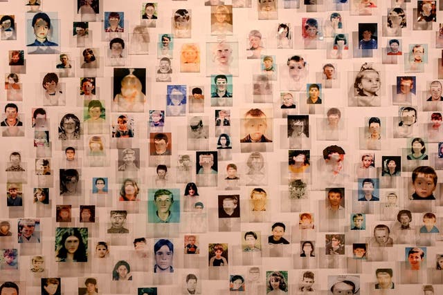 Portraits, at the ‘Once upon a time and never again’ exhibition, of some of the 1,133 children killed during the war