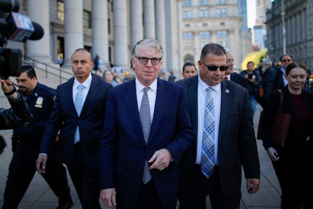 Cyrus Vance Jr, centre, the Manhattan district attorney outside the US Courthouse in New York City