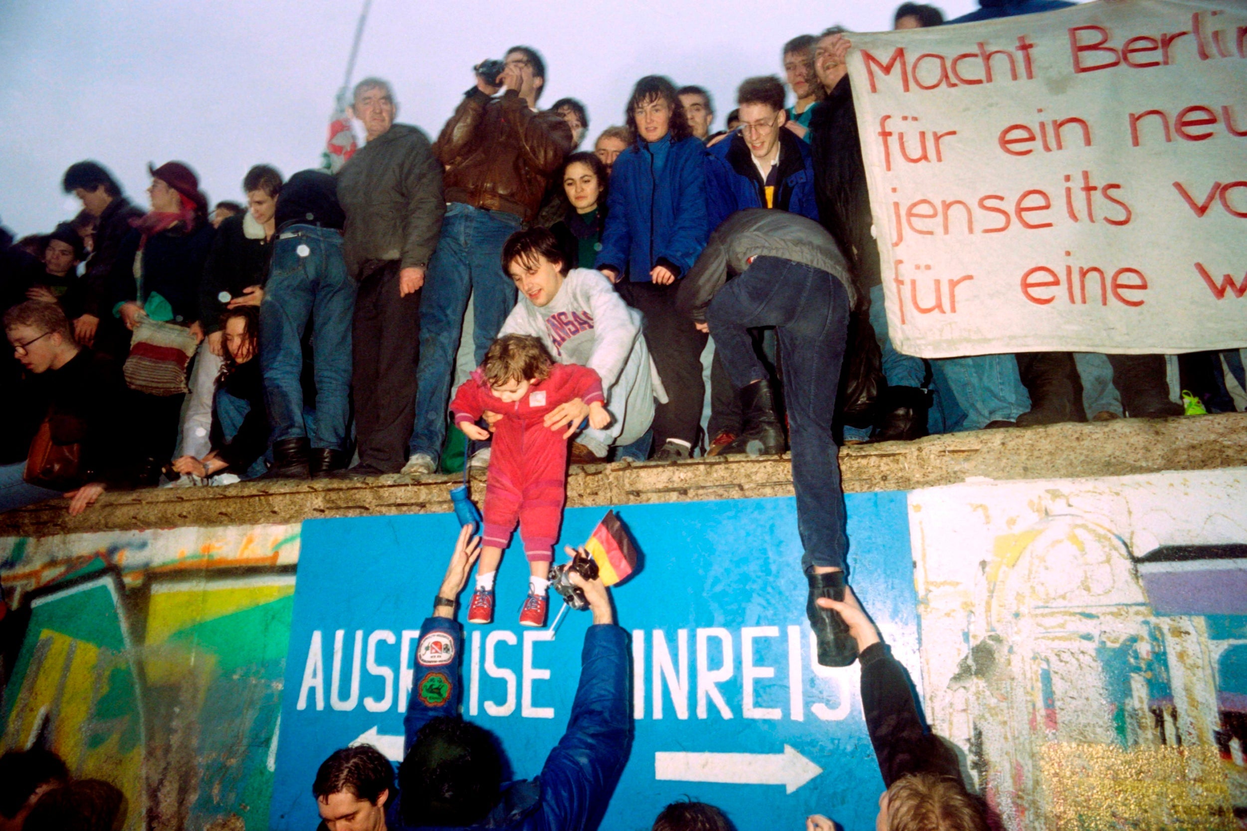 East Germans greet citizens of West Germany at the Brandenburg Gate in Berlin on 22 December 1989 (AFP/Getty)