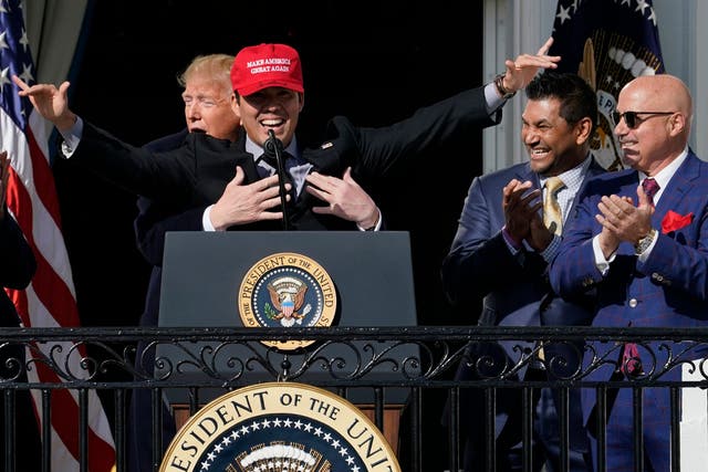 Donald Trump grabs Washington Nationals pitcher Kurt Suzuki during a reception at the White House