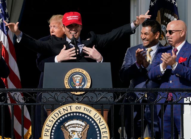 Donald Trump grabs Washington Nationals pitcher Kurt Suzuki during a reception at the White House