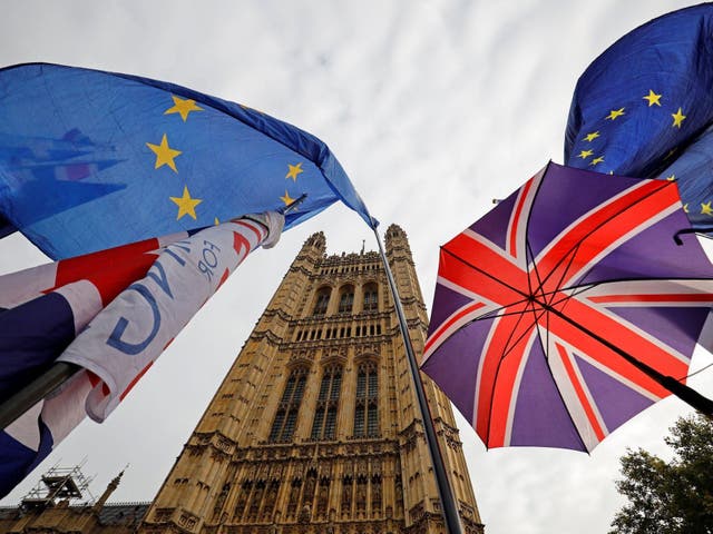 EU and Union Jack flags fly outside the Houses of Parliament in October