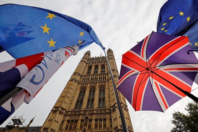 EU and Union Jack flags fly outside the Houses of Parliament in October