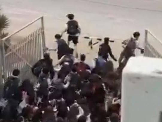 Students break out of school gates to join protests in Chile
