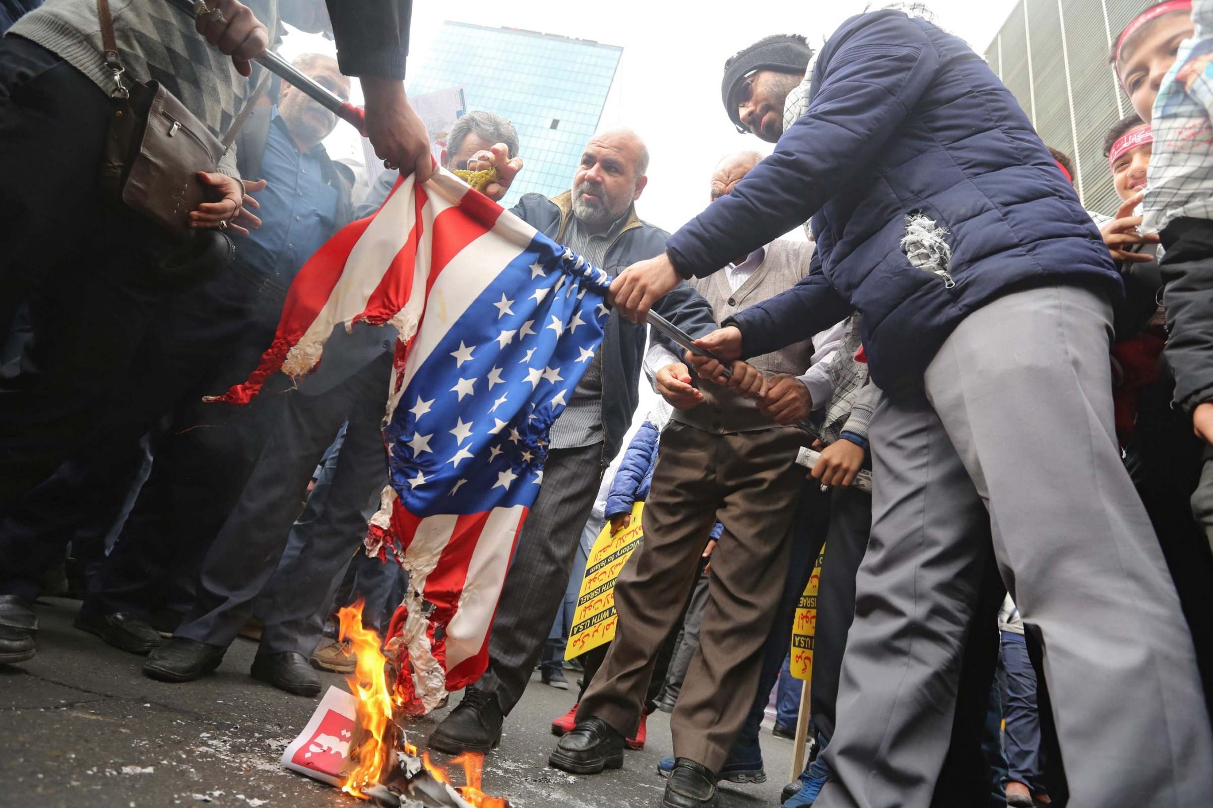 Iranian protesters set a US flag on fire during a rally outside the former US embassy in the Iranian capital Tehran on November 4, 2019, to mark the 40th anniversary of the Iran hostage crisis