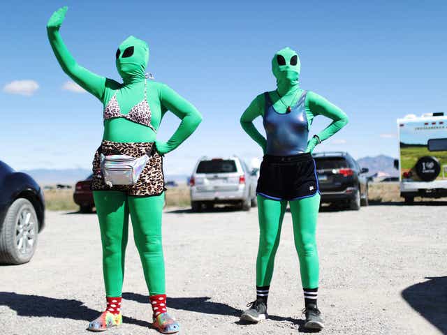 Women dressed as aliens at a Storm Area 51 spinoff event called Alienstock on 20 September in Rachel, Nevada